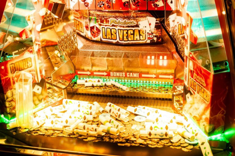 Colorful casino game machine featuring Las Vegas theme with coins and poker cards.